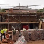 Timber Frame House With Brick Cladding