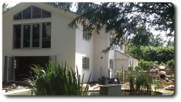 Pond View of House with Extension