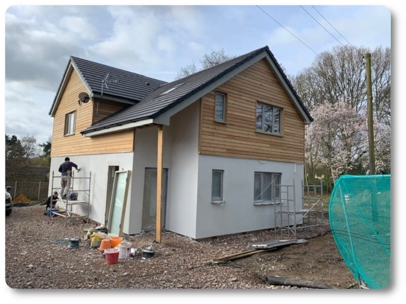 Front View of New Build Home showing Second Paint Coat Being Applied