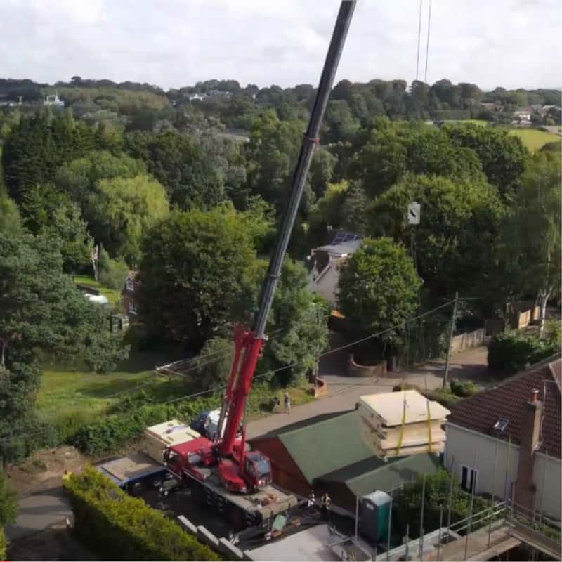 Crane Lifting Timber Frame Panel into Self Build Home