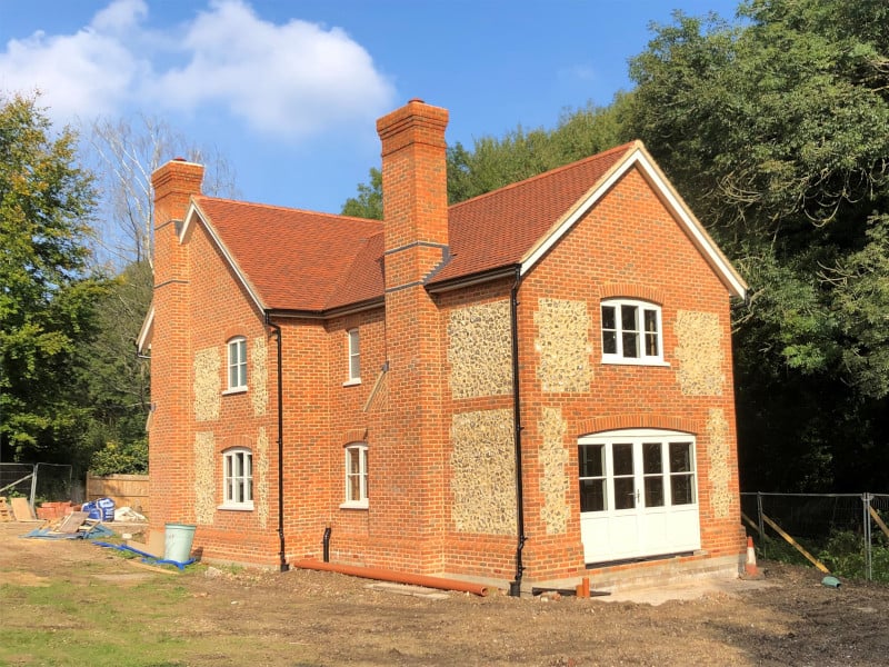 Timber Frame House with Brick and Stone Cladding